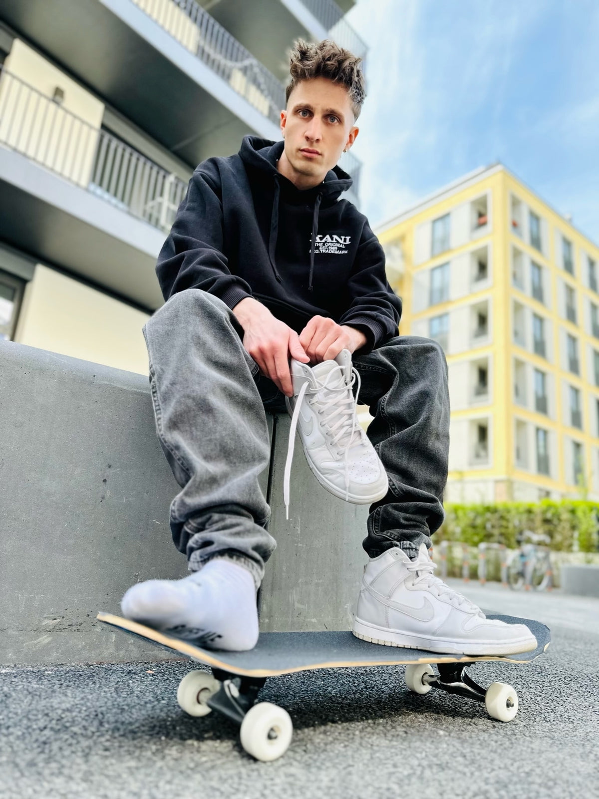 Close-up of white fetish socks with SNFF ME print – Sk8erboy® socks as a provocative fetish statement in an urban skater look.