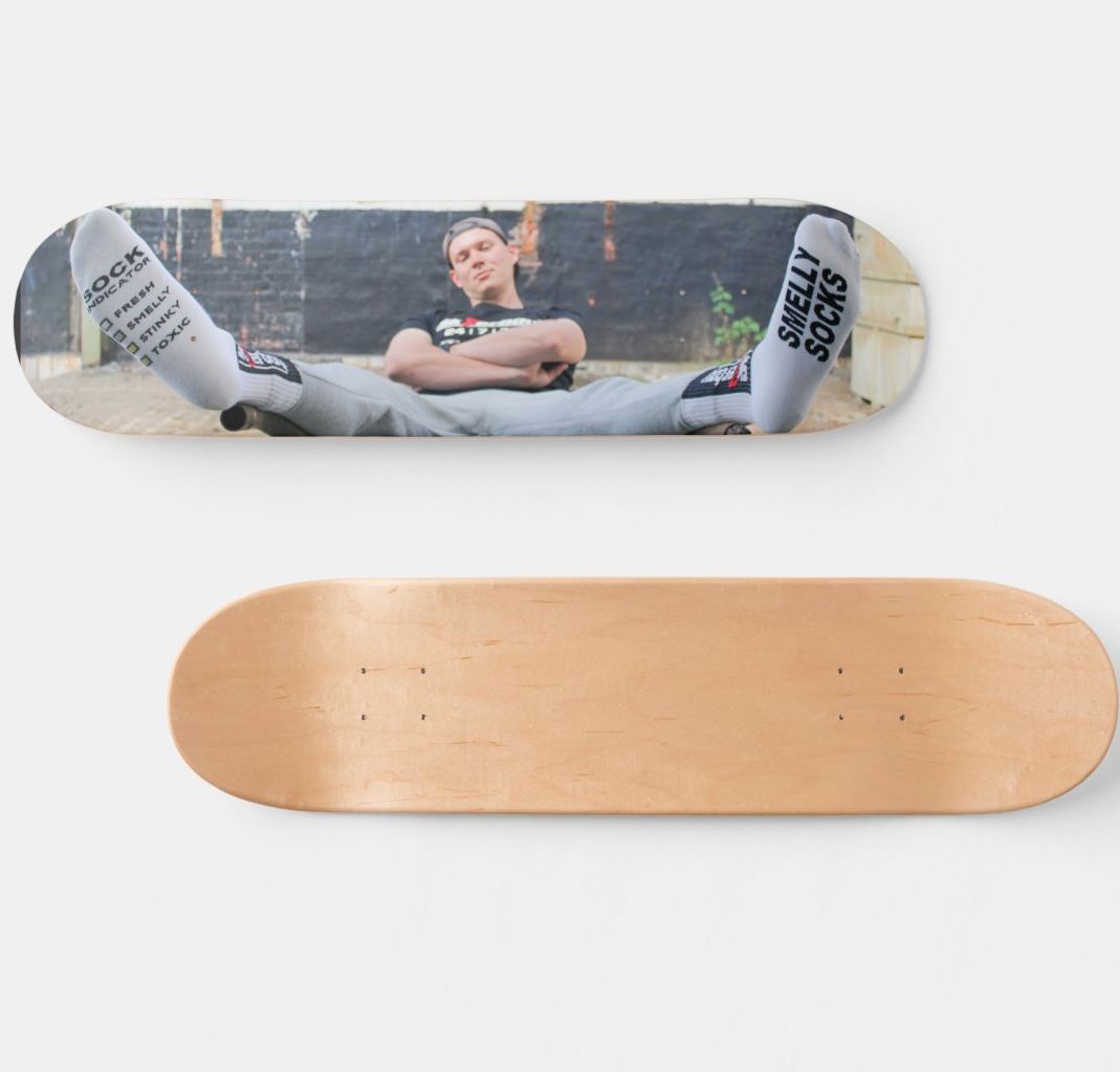 Limited Sk8erboy skateboard from the USA, made of USA maple wood and crafted by a pro. Exclusively at Sk8erboy—use as wall decor or with mounted wheels, grip and trucks, also in the halfpipe. Smelly Socks model underside, bare wood top.