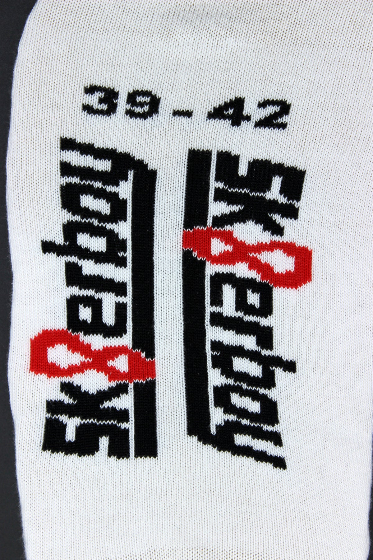 Close-up of sk8erboy sneaker socks for summer in Nike or Adidas sneakers with a large logo on the sole