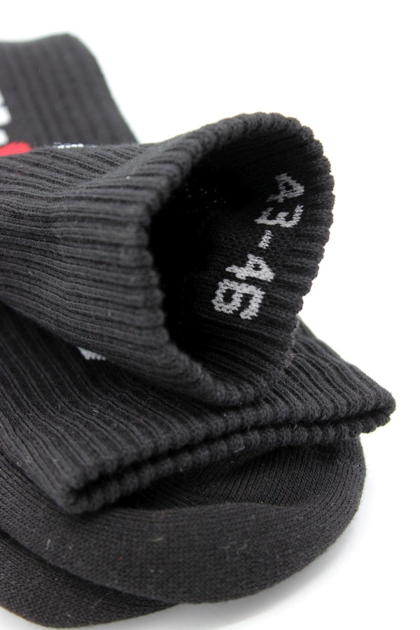 sk8erboy crew socks in black with white sk8erboy lettering and red 8 close-up