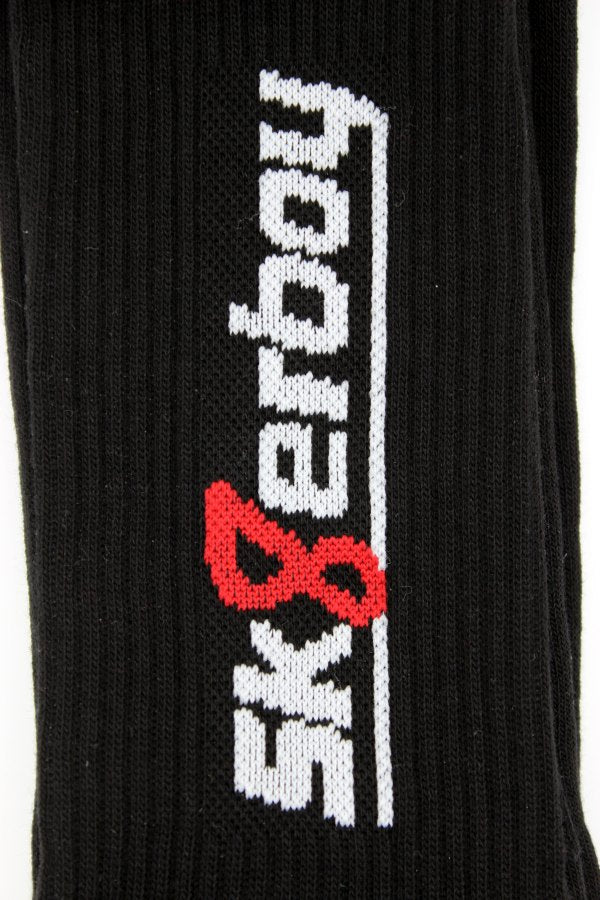 sk8erboy crew socks in black with white sk8erboy lettering and red 8 cuff in close-up